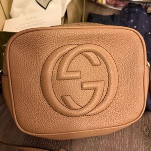 Beautiful bag but never wear it, selling it because I only wear the black.